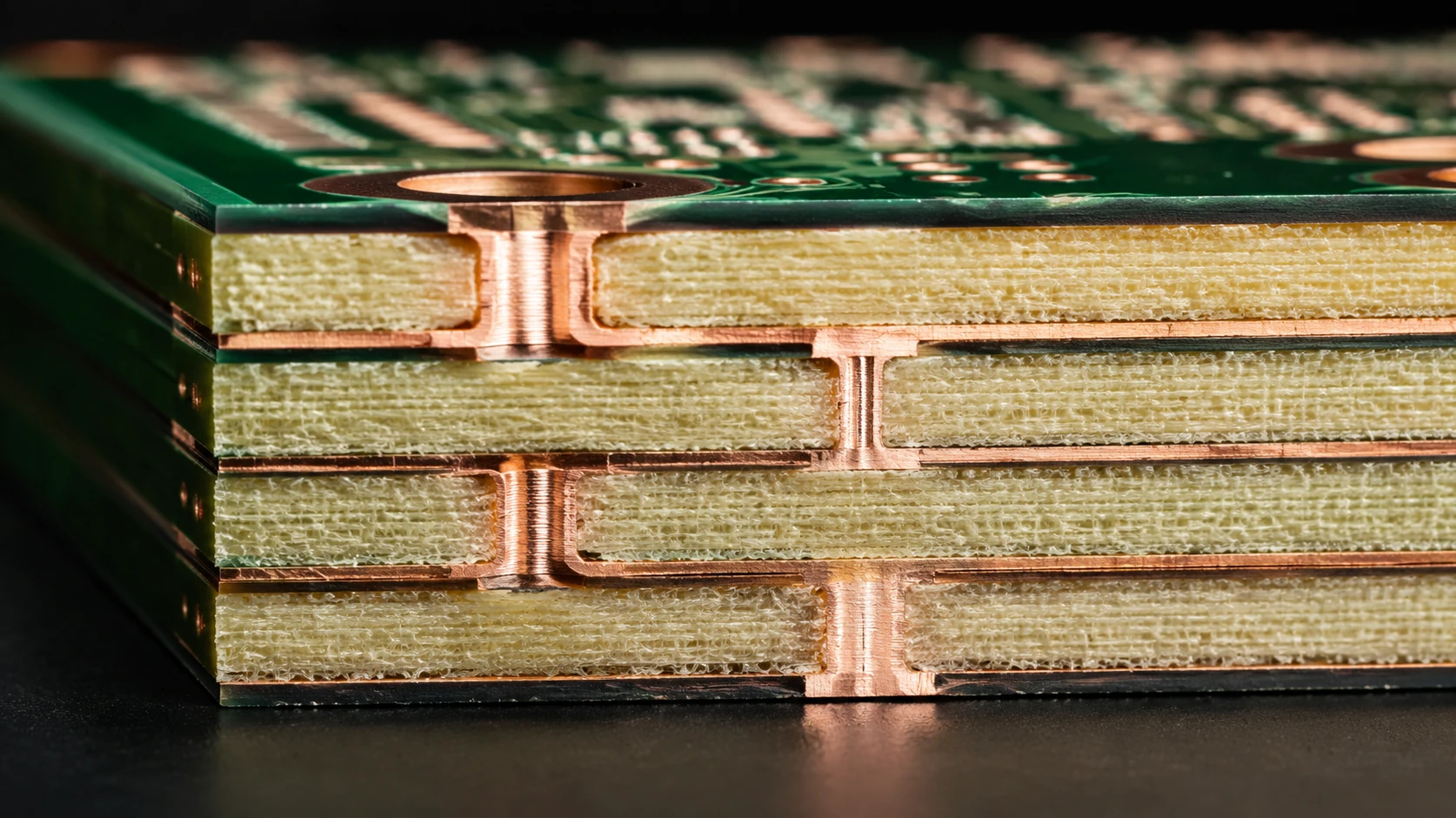 High-quality multi-layer High-Tg FR4 PCB cross-section demonstrating uniform glass-epoxy matrix lamination and internal layer alignment High-quality multi-layer High-Tg FR4 PCB cross-section demonstrating uniform glass-epoxy matrix lamination and internal layer alignment